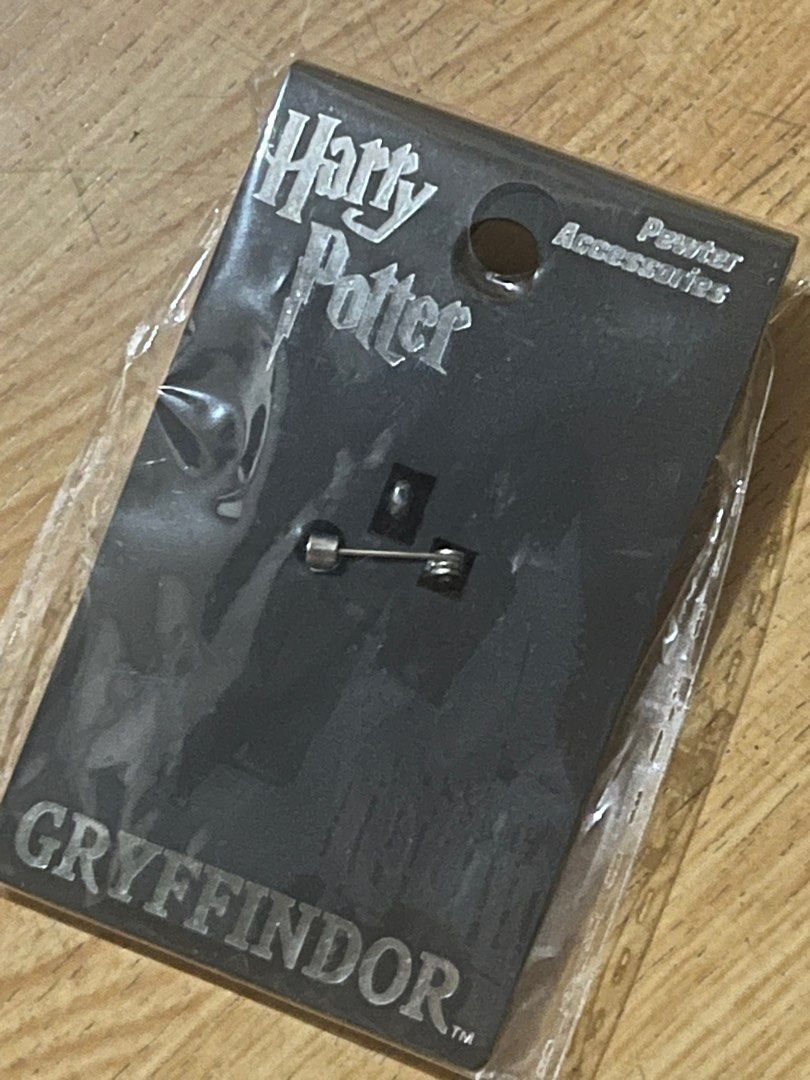 Harry Potter - Gryffindor Pin (Category: Western Merchandise) located in Mandaluyong City. Submitted by decluttering.manda (Listing ID 1402001896, Image 2). Description: Harry Potter Gryffindor Pin. Brand new & unused..
