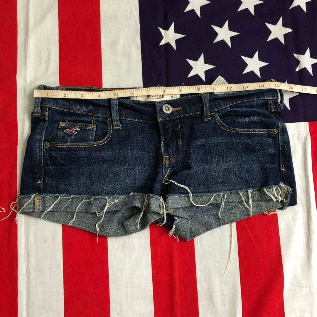 Hollister Denim Shorts - Size 25 (Category: Shorts) located in Manila. Submitted by nei00 (Listing ID 1401968171, Image 3). Description: - Hollister denim shorts - Dark wash - Size 25 - Frayed hem - Classic five-pocket design - Button and zipper closure - Hollister logo on front pocket - Made in Vietnam.
