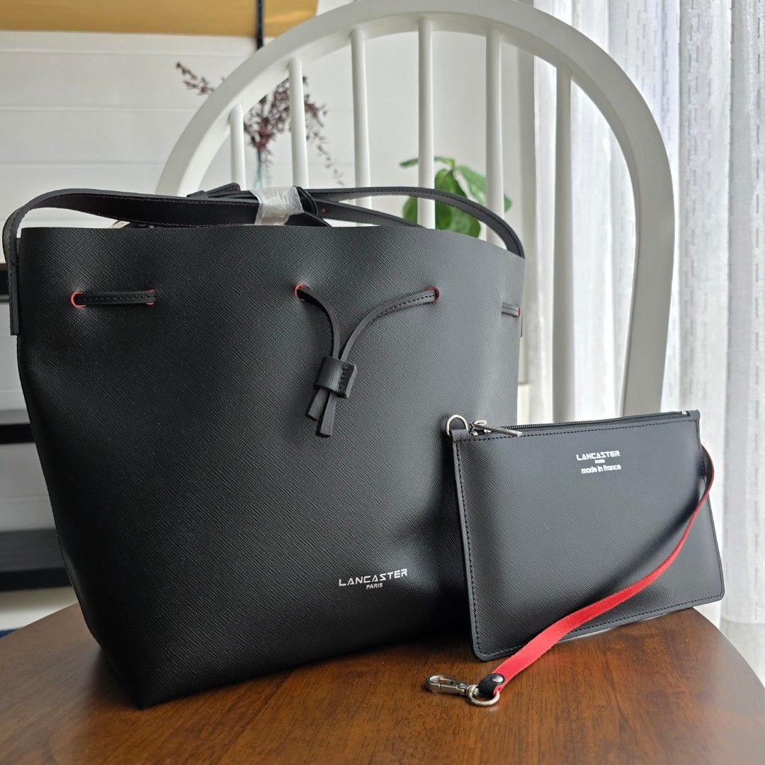 Lancaster Paris Bucket Large Bag with Pouch (Category: Luxury Bags & Wallets) located in Paranaque City. Submitted by portodimoda (Listing ID 1401950434, Image 1). Description: AUTHENTIC!!! 10,800 each Noir/ red Noir/ gold Blue/ silver - SOLD Comes with a dustbag only.
