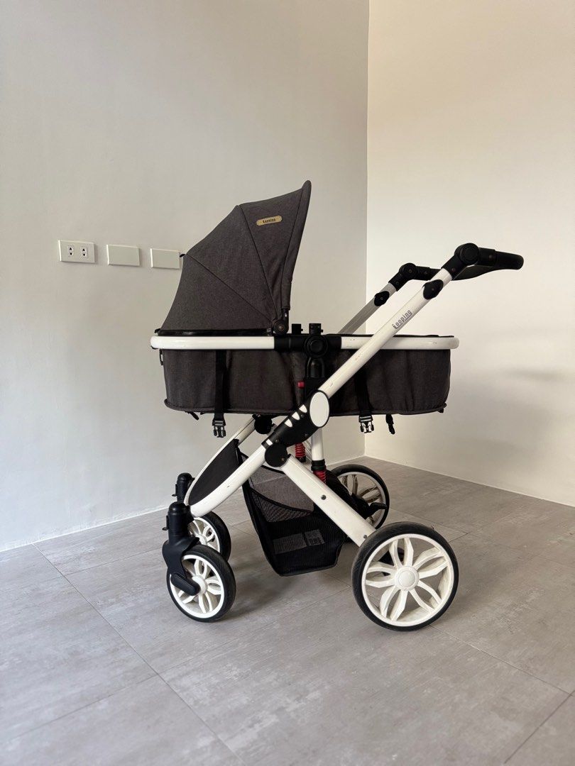 Looping Sydney Baby Stroller (Category: Strollers) located in Paranaque City. Submitted by prebyb (Listing ID 1401977612, Image 1). Description: Looping baby stroller with a dark grey canopy and seat. Features a white frame with black accents and wheels. Includes a storage basket underneath. The stroller has a reversible seat and adjustable handle. Some wear and tear is visible on the frame and handle. Please message me if you’d like to see more 