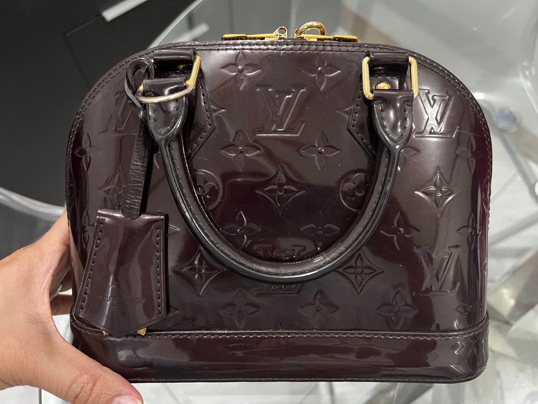Louis Vuitton Alma BB Amarante (Category: Luxury Bags & Wallets) located in Valenzuela. Submitted by iamirinechua (Listing ID 1401931797, Image 3). Description: For sale: Preloved Louis Vuitton Alma BB in Amarante Vernis Leather. With receipt, booklet & dust bag Made in France Bought for KWD530.000 or PHP87,683.22 Current price: USD2090 or PHP104,626.44 (tax exclusive) (https://us.louisvuitton.com/eng-us/products/alma-bb-monogram-vernis-000478) T