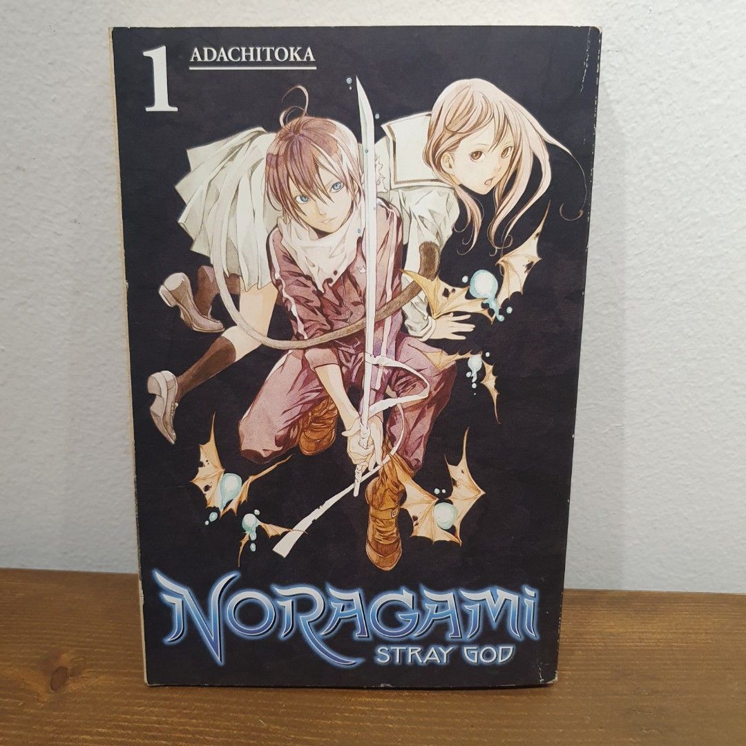 Noragami: Stray God by Adachitoka (Category: Comics & Manga) located in San Juan City. Submitted by mybeautybasket (Listing ID 1402047723, Image 1). Description: Book 1 in a series of 27 tankōbon volumes. The story revolves around a minor god named Yato, who is down on his luck and struggling to gain followers. One day, a high school girl named Hiyori Iki saves Yato from an oncoming bus, but ends up getting hit herself. The incident causes her so