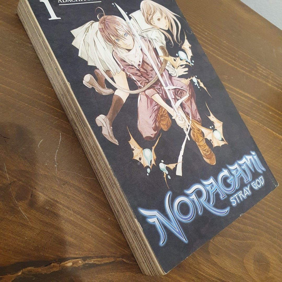 Noragami: Stray God by Adachitoka (Category: Comics & Manga) located in San Juan City. Submitted by mybeautybasket (Listing ID 1402047723, Image 3). Description: Book 1 in a series of 27 tankōbon volumes. The story revolves around a minor god named Yato, who is down on his luck and struggling to gain followers. One day, a high school girl named Hiyori Iki saves Yato from an oncoming bus, but ends up getting hit herself. The incident causes her so