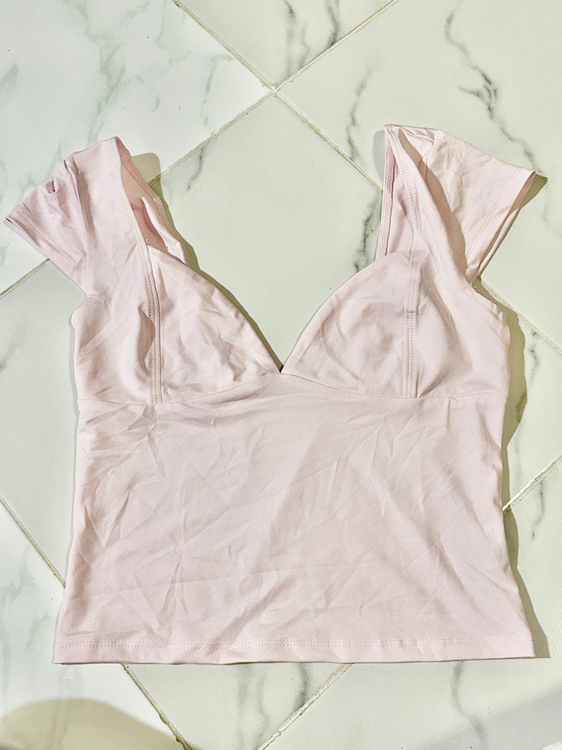 Pink Crop Top (Category: Others Tops) located in Manila. Submitted by cchaiprincess (Listing ID 1401948463, Image 1). Description: bought from tiktok shop, never worn - Pink crop top - V-neck design - Short sleeves - Fitted silhouette - Lightweight fabric - Solid color - Versatile for different outfits - Stylish piece.