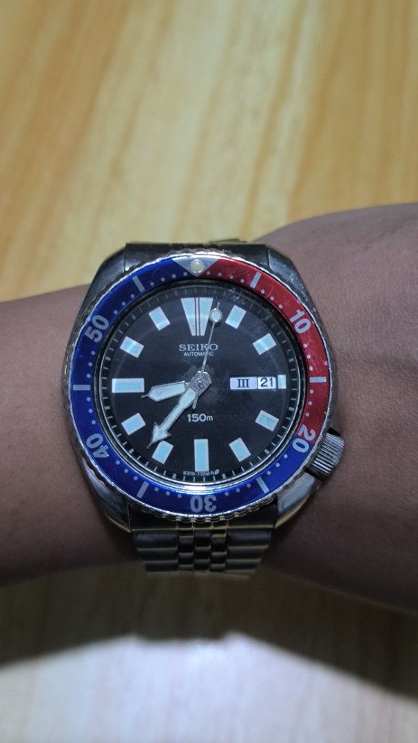Seiko Automatic Diver Watch (Category: Men's Watches) located in Taguig. Submitted by tester1x (Listing ID 1401963029, Image 1). Description: - Seiko automatic diver watch - Black dial with day-date display - Blue and red bezel - Stainless steel bracelet - 6309 729A - 7D1661 - 7 inch plus wrist size - Patina sa gitna.