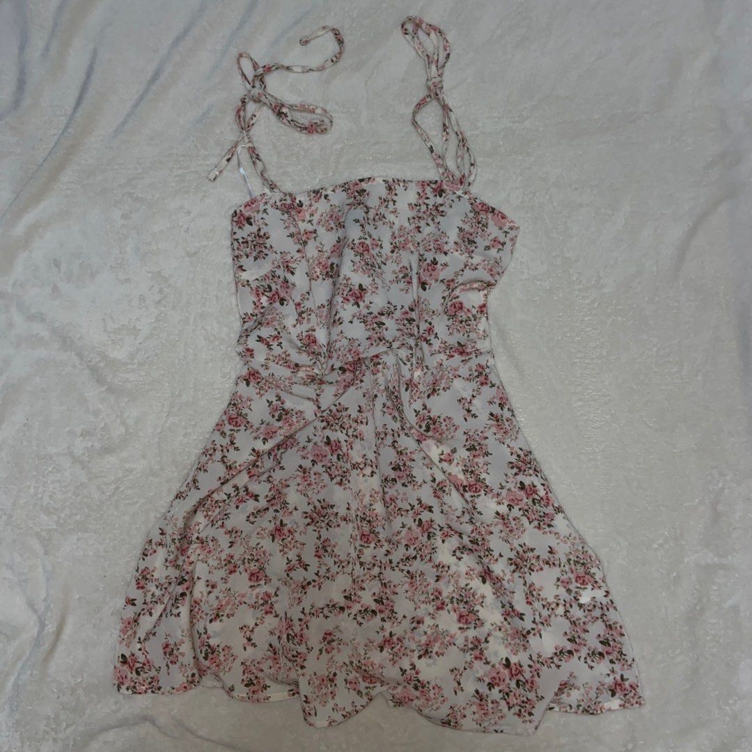 Shein Floral Mini Dress (Category: Dresses) located in Manila. Submitted by sshshm (Listing ID 1402020010, Image 1). Description: - Shein floral mini dress - Tie straps - Ruched bodice - Flowy skirt - White base with pink floral print - Size: Small (EU 36, US 4) - Made in China.