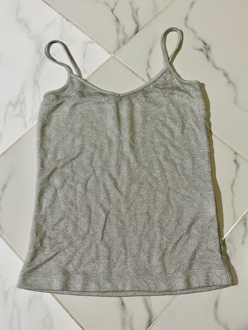 Silver Sparkle Tank Top (Category: Sleeveless) located in Manila. Submitted by cchaiprincess (Listing ID 1401948467, Image 1). Description: freebie if u buy minimum of 600 pesos - Silver sparkle tank top - Size: Small - Thrifted - Adds a touch of shimmer - Perfect for casual or night-out looks.
