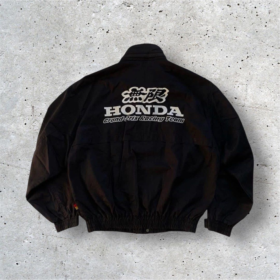 Vintage Honda Mugen Team Jacket (Category: Coats, Jackets and Outerwear) located in Manila. Submitted by jstash09 (Listing ID 1402038886, Image 2). Description: - Black Honda jacket - White accents - Honda logo on front and back - Stowable hood - Zipper and snap closures - White and black collar - From the "Honda Collection".