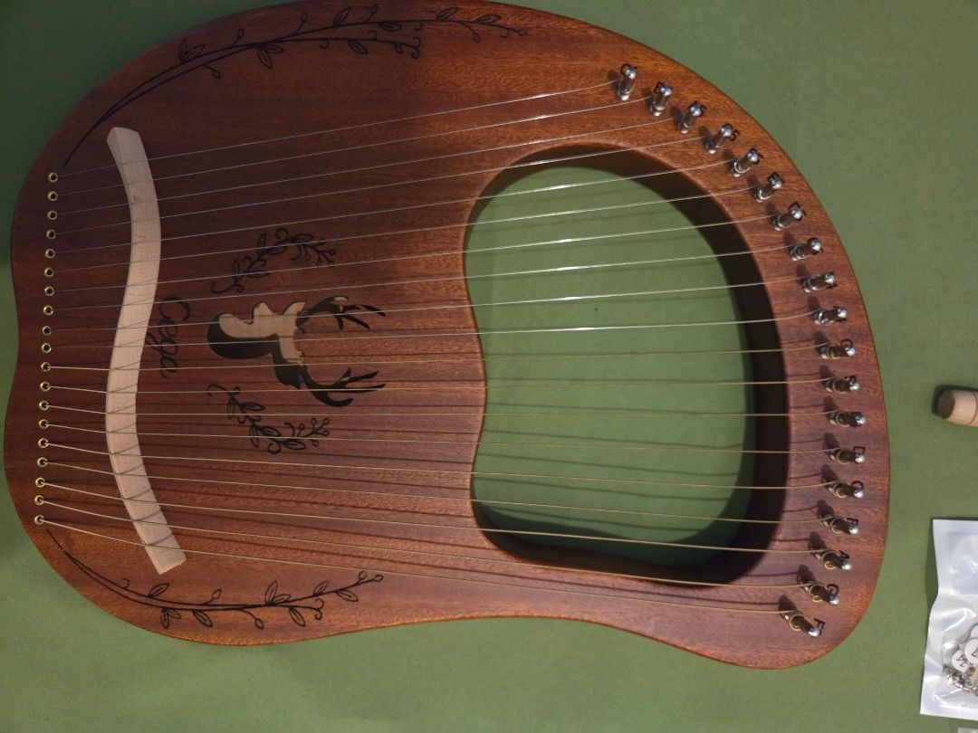 Wooden Lyre/Small Harp (Category: Musical Instruments) located in Manila. Submitted by ipictureda90729 (Listing ID 1402003399, Image 2). Description: Never used. With minor flaws due to handling RFS: never learned how to play, need the funds.