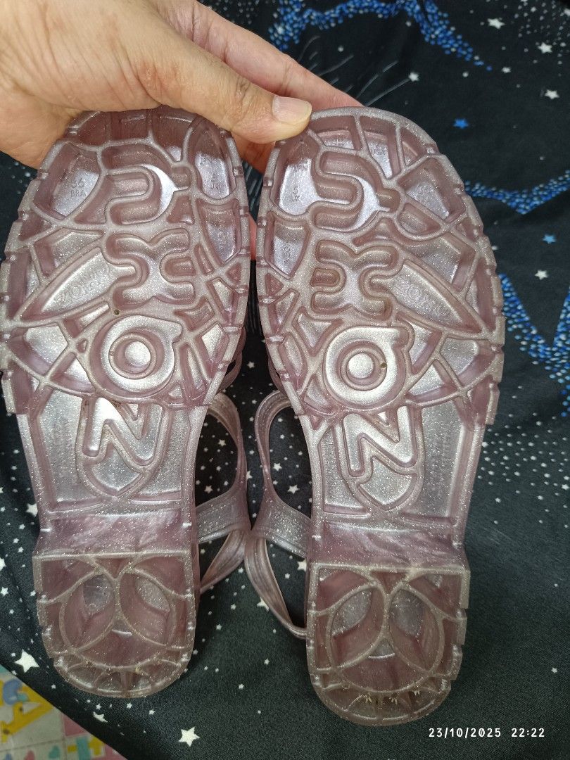 Zaxy Be New Sand - Glitter Nude Sandals (Category: Flats & Sandals) located in San Jose del Monte. Submitted by twinkletoes_ph (Listing ID 1402055593, Image 3). Description: These Zaxy sandals are a glittery nude color. They have a cage-like design with a buckle closure. The sandals appear to be unworn and come with their original box. The soles have a textured pattern for grip. The Zaxy logo is visible on the sandals and the box..