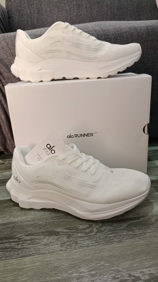 Alo Yoga Runner White Sneakers (Category: Sneakers) located in Valenzuela. Submitted by jannah528 (Listing ID 1407088931, Image 2). Description: - Brand new Alo Yoga Runner sneakers - Color: White - Size: US 10, UK 9, EU 44 - Includes original box and tags - Sleek design - Unworn condition.