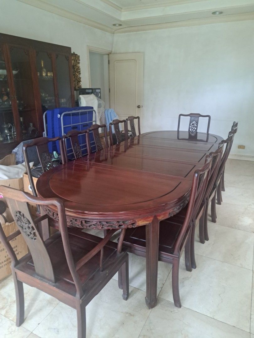 Antique Wooden Dining Table Set (Category: Tables & Sets) located in Makati City. Submitted by corglee (Listing ID 1407092920, Image 1). Description: ☆RARE Antique Vintage Oriental Dining Set ● 12 seater ●Solid RoseWood ●L 113.5 x W45.5 X H 30.5 in. ●Imported ●Intricate carvings on table edges ●Matching chairs with detailed backrests ●Never Used, just displayed ●P250,000 ●Retail Price : Approx USD $10,500 = P615,613 ●Pick Up: Ayala Alabang **Pls 
