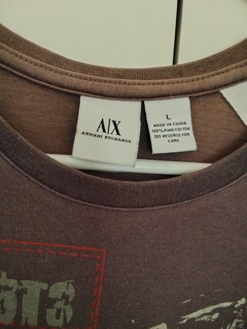 Armani Exchange Graphic Tee - Large (Category: Tshirts & Polo Shirts ) located in Quezon City. Submitted by maniladeclutter (Listing ID 1407146788, Image 2). Description: ORIGINAL - Armani Exchange graphic tee - Color: Gray - Size: Large - Design: Printed logo - Material: 100% cotton - Features: Crew neck, short sleeves A bit fading.