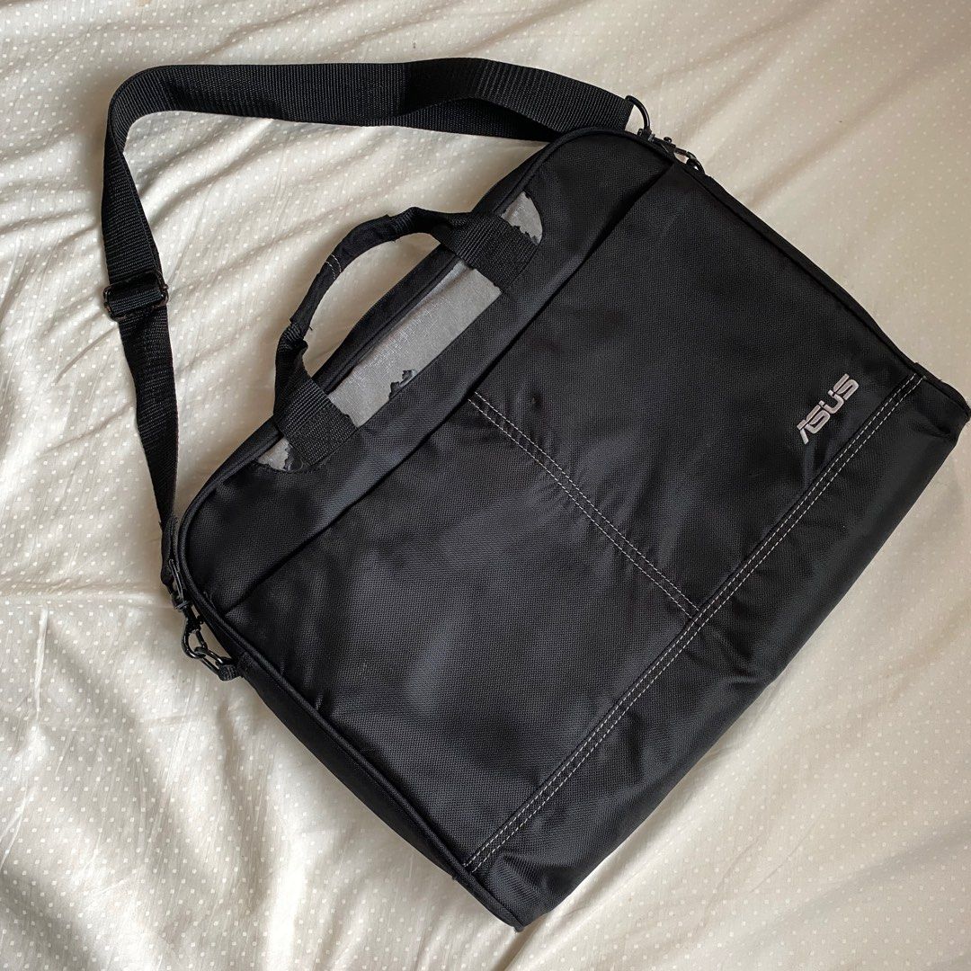 ASUS Laptop Bag with Shoulder Strap (Category: Laptop Bags & Sleeves) located in Muntinlupa City. Submitted by fika_thriftshop (Listing ID 1407114191, Image 1). Description: -Flaws: cracking and falling down of black synthetic leather layer on the bottom of the handles. If you remove those, you will be left with a gray fabric layer only which is still intact as seen in the photos. -The insides are intact and well-maintained. No staining whatsoeve