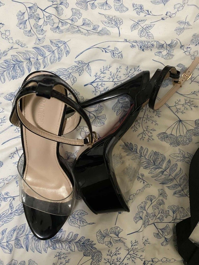 Black High Heels (Category: Heels) located in Dolores. Submitted by solfinds (Listing ID 1407105387, Image 1). Description: - 6 inch Black patent leather heels - Clear strap design - Secure buckle closure - Platform sole Good as new - Stiletto heel - Perfect for special occasions.