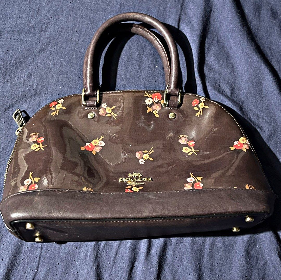 Coach Floral Dome Satchel (no strap) (Category: Luxury Bags & Wallets) located in Taguig. Submitted by random.stuff31 (Listing ID 1407088183, Image 1). Description: Coach Floral Dome Satchel – 100% Authentic Add a touch of elegance to your everyday look with this beautiful Coach Floral Dome Satchel. Crafted with a glossy chocolate-brown finish and accented with charming floral prints, this piece is both stylish and timeless. Features: • Zip-top c
