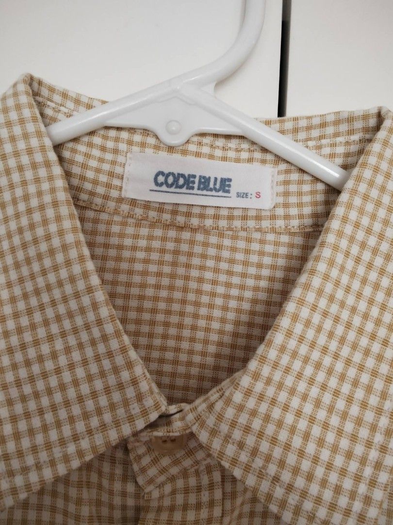 Code Blue Checkered Short Sleeve Shirt - Size S (Category: Tshirts & Polo Shirts ) located in Quezon City. Submitted by maniladeclutter (Listing ID 1407148672, Image 2). Description: - Code Blue short sleeve shirt - Size: S - Color: Beige and white - Pattern: Checkered - Features: Button-down front, single chest pocket - Collar: Classic.