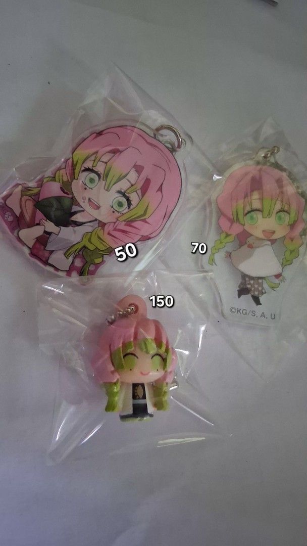 Demon Slayer Mitsuri Kanroji Keychains (Category: Character Goods) located in Aurora. Submitted by chi_thrifts (Listing ID 1407079278, Image 1). Description: - Demon Slayer: Mitsuri Kanroji Keychains - Includes: - acrylic keychain (₱50) - acrylic keychain (₱70) - Chibi figure keychain (₱150) - All keychains are new and sealed. - 250 if set CHECK MY PROFILE FOR MORE ANIME MERCH GCASH/SPX.