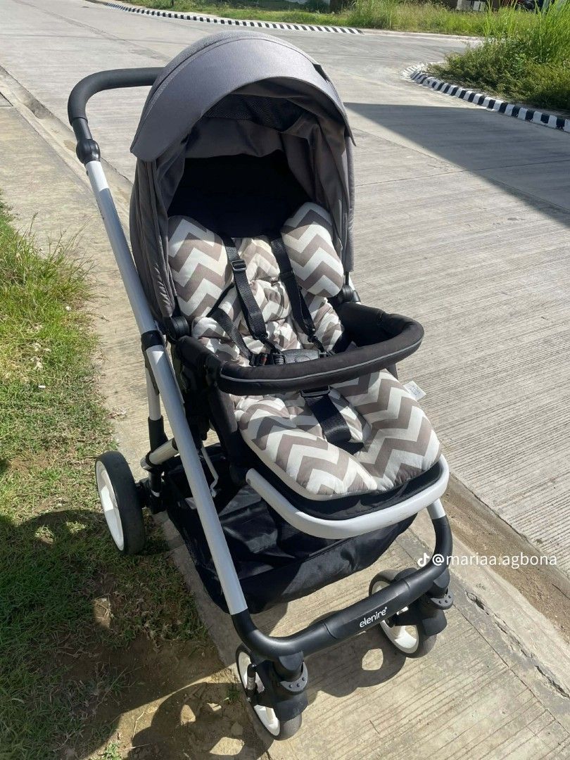 Elenire Baby Stroller (Category: Strollers) located in Pateros City. Submitted by DreiMar (Listing ID 1407027229, Image 1). Description: - Elenire stroller - Grey canopy - Patterned seat - Spacious storage basket - Comfortable seat with safety harness - Sleek design with white and black accents (Twice used) original Price ₱3,500.