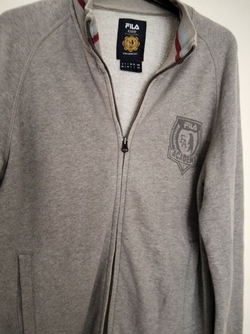 Fila zip-up jacket size S (Category: Coats, Jackets and Outerwear) located in Quezon City. Submitted by maniladeclutter (Listing ID 1407157880, Image 3). Description: ORIGINAL - Fila Academy zip-up jacket - Full-zip closure - Two front pockets - Ribbed collar, cuffs, and hem with burgundy stripes - Fila Academy logo on chest - Classic, sporty design.