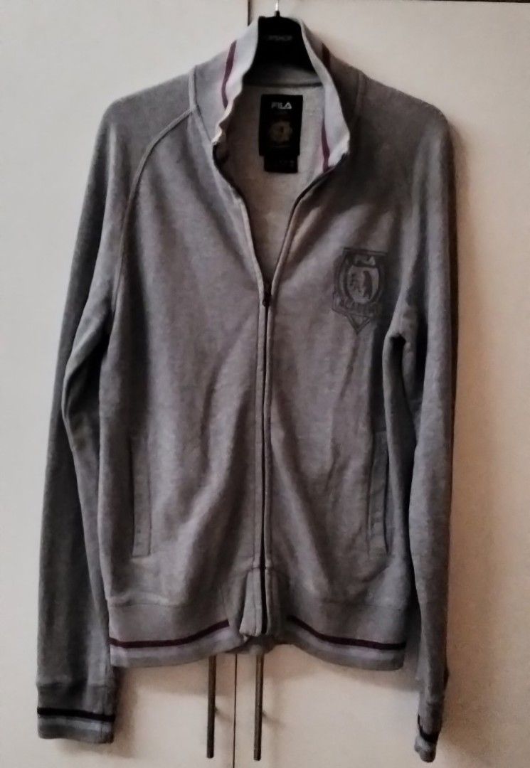 Fila zip-up jacket size S (Category: Coats, Jackets and Outerwear) located in Quezon City. Submitted by maniladeclutter (Listing ID 1407157880, Image 1). Description: ORIGINAL - Fila Academy zip-up jacket - Full-zip closure - Two front pockets - Ribbed collar, cuffs, and hem with burgundy stripes - Fila Academy logo on chest - Classic, sporty design.