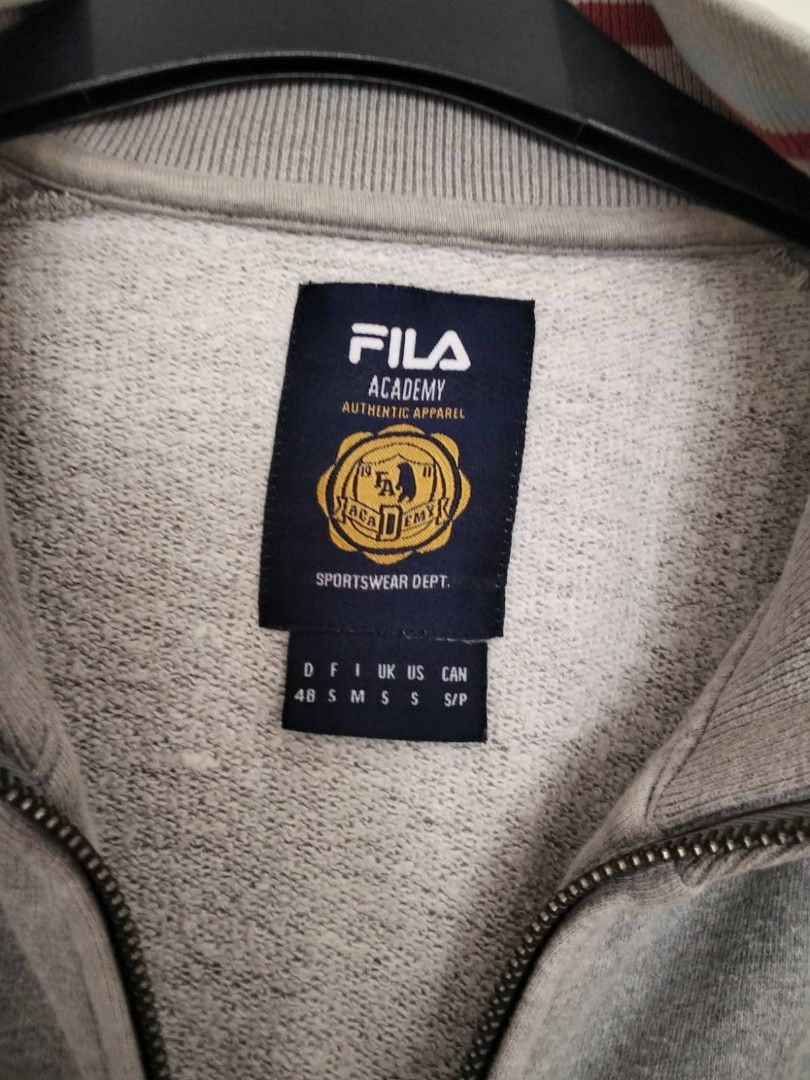 Fila zip-up jacket size S (Category: Coats, Jackets and Outerwear) located in Quezon City. Submitted by maniladeclutter (Listing ID 1407157880, Image 2). Description: ORIGINAL - Fila Academy zip-up jacket - Full-zip closure - Two front pockets - Ribbed collar, cuffs, and hem with burgundy stripes - Fila Academy logo on chest - Classic, sporty design.