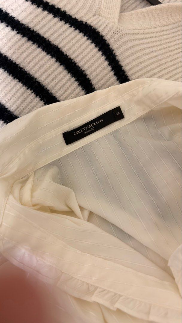 G2000 WOMAN White Polo (Category: Blouses) located in Quezon City. Submitted by declutterw_v (Listing ID 1407163986, Image 2). Description: - C2GOOD WOMAN white blouse - Striped design - Ruffled front detail - Long sleeves - Classic collar - Size 32 - Suitable for casual and formal wear.