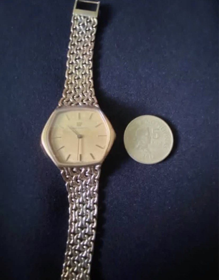 Girard-Perregaux Gold Watch (Category: Luxury Watches) located in Paranaque City. Submitted by bloo_berry (Listing ID 1407191345, Image 1). Description: Elegant Girard-Perregaux watch with a gold-toned hexagonal face and a matching gold chain-link strap. The watch features a simple, clean dial with stick hour markers and the brand's logo. The back of the watch is also gold-toned. Bracelet approximately 6 inches. Selling as is. ₱24,850 This is a v