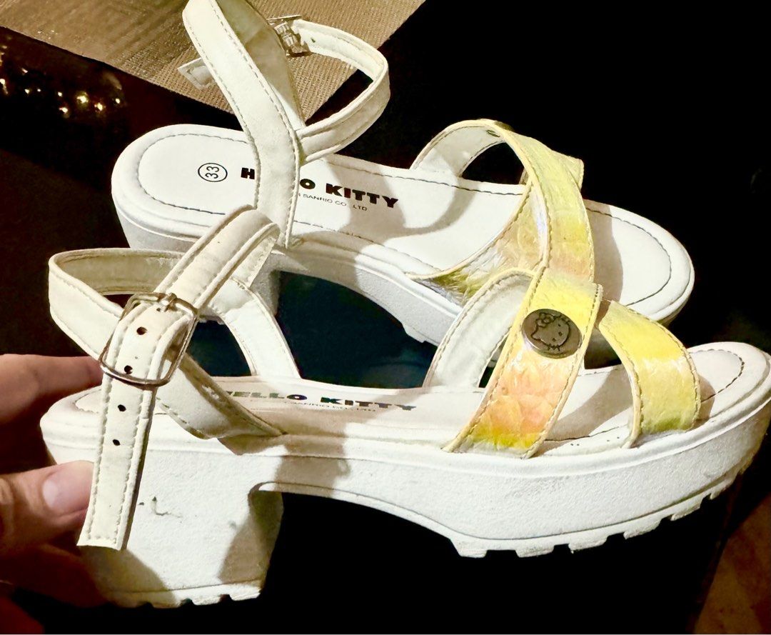 Hello Kitty Platform Sandals Size 33 (Category: Babies & Kids Fashion) located in Paranaque City. Submitted by ledzai (Listing ID 1407060092, Image 3). Description: - Hello Kitty platform sandals - White with iridescent straps - Size 33 - Buckle closure - Kitty emblem - Chunky platform sole -Size 21cm -kids 7 to 9 yrs old -note: maganda pa sya kasi 3x lang nagamit i bought in SM Malls.