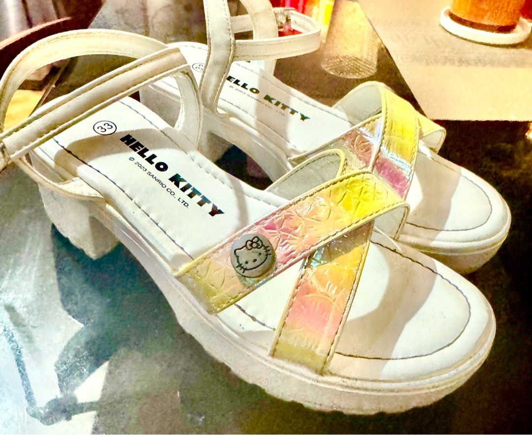 Hello Kitty Platform Sandals Size 33 (Category: Babies & Kids Fashion) located in Paranaque City. Submitted by ledzai (Listing ID 1407060092, Image 1). Description: - Hello Kitty platform sandals - White with iridescent straps - Size 33 - Buckle closure - Kitty emblem - Chunky platform sole -Size 21cm -kids 7 to 9 yrs old -note: maganda pa sya kasi 3x lang nagamit i bought in SM Malls.