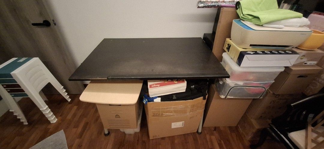 Ikea Study table - Adjustable height & angle (Category: Tables & Sets) located in Singapore. Submitted by justin_db (Listing ID 1407140639, Image 2). Description: Ikea study table 1.2m x 0.8m. Variable angle and height (not automated). Very well used but still a great table, plenty of space for working and storing some of your stuff. Let me know if you have any questions and I'll answer what I can. Currently assembled but can be disassembled for 