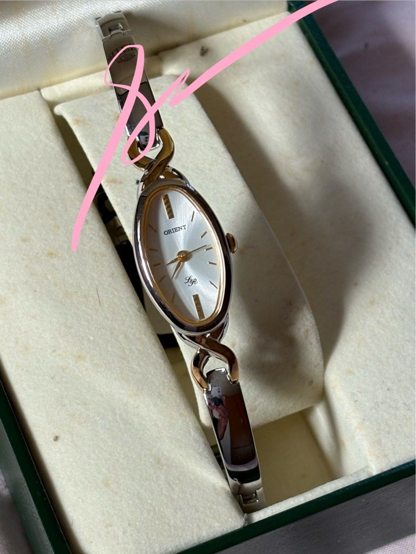 Ladies watch (Category: Luxury Watches) located in San Pedro. Submitted by icesyp (Listing ID 1407137766, Image 2). Description: Orient Lady Rose watch with a two-tone (silver and gold) metal bracelet. Used less than 5x. Great for formal occassions. Price negotiable but no low ballers Rfs-Not using anymore .