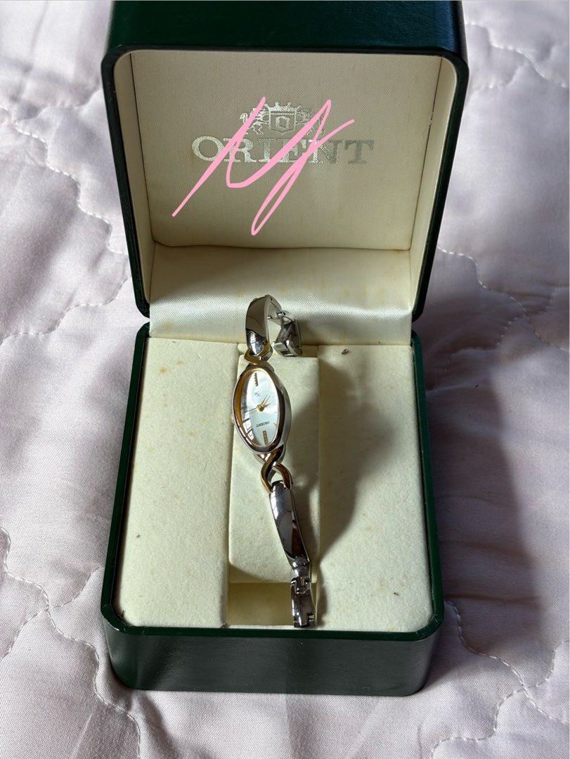 Ladies watch (Category: Luxury Watches) located in San Pedro. Submitted by icesyp (Listing ID 1407137766, Image 3). Description: Orient Lady Rose watch with a two-tone (silver and gold) metal bracelet. Used less than 5x. Great for formal occassions. Price negotiable but no low ballers Rfs-Not using anymore .