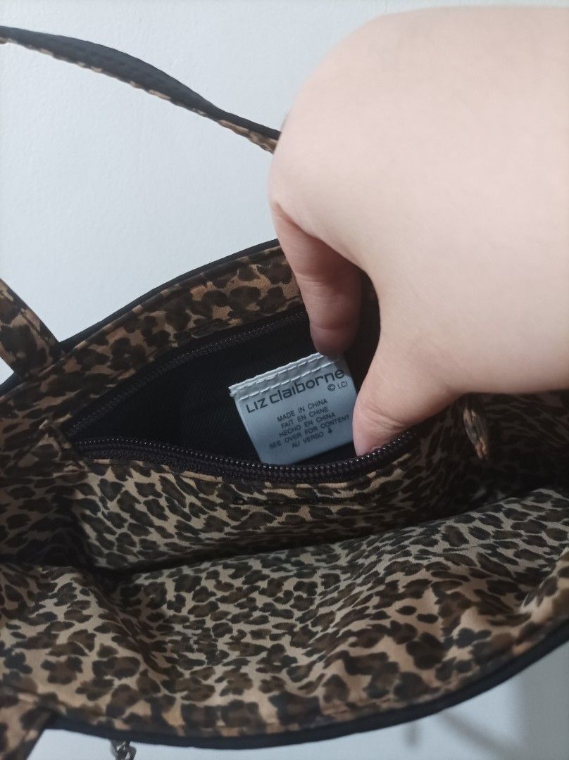 Liz Claiborne Mini Tote Black Handbag (Category: Purses & Pouches) located in Quezon City. Submitted by 90sradar (Listing ID 1407081068, Image 2). Description: black and animal print polyester material hidden magnetic closure 2 zipper compartments width - 9" height -5" depth -3".