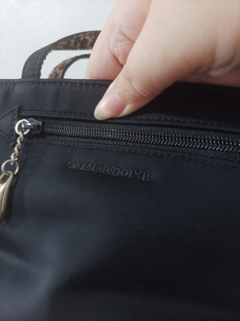 Liz Claiborne Mini Tote Black Handbag (Category: Purses & Pouches) located in Quezon City. Submitted by 90sradar (Listing ID 1407081068, Image 3). Description: black and animal print polyester material hidden magnetic closure 2 zipper compartments width - 9" height -5" depth -3".