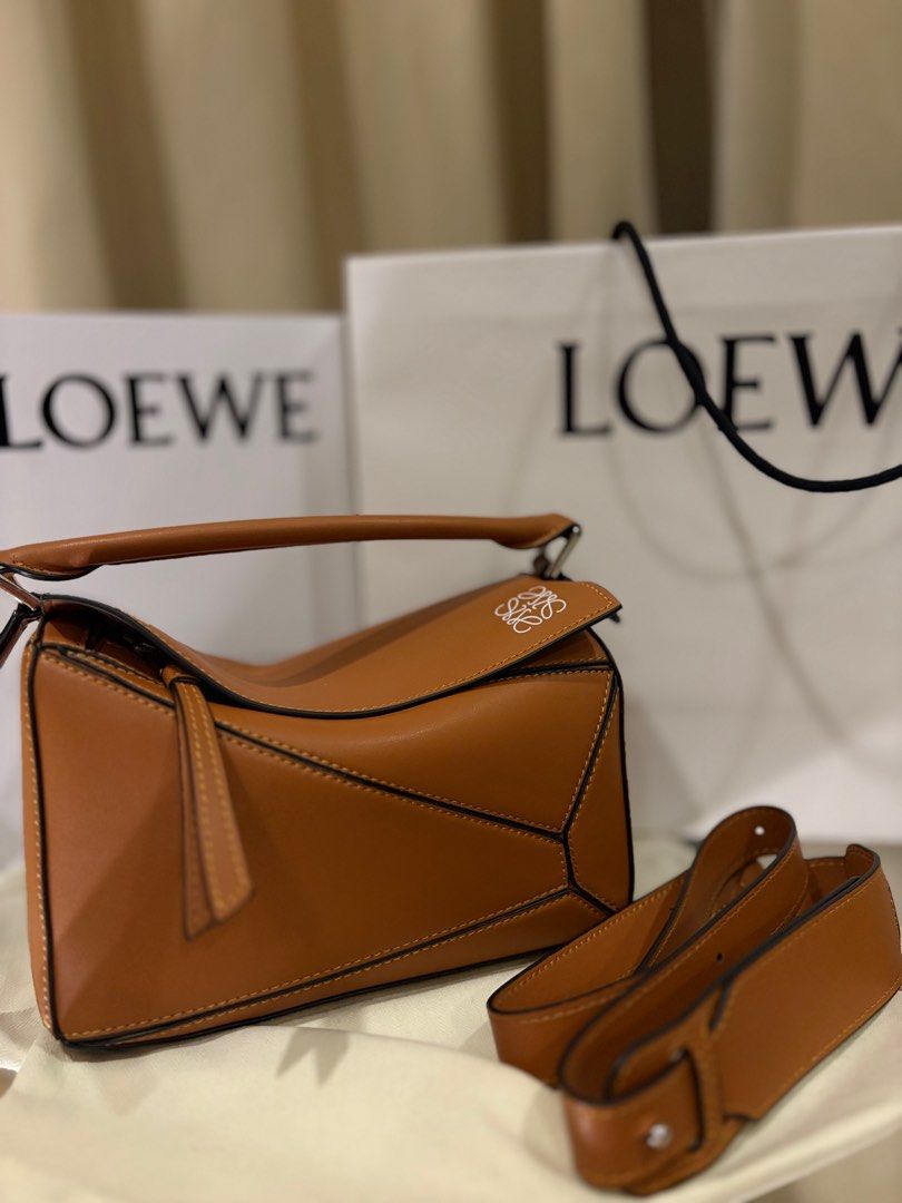 Vintage Loewe Puzzle Bag - Tan (Category: Luxury Bags & Wallets) located in Manila. Submitted by pursonalshopper (Listing ID 1407184490, Image 1). Description: Loewe Small Puzzle Bag Bought from Hongkong. It pre loved. COMPLETE INCLUSIONS: ✅Dustbag ✅Box & paperbag ✅Extra Loewe Sling strap ✅Authenticity card Dimensions: approximately 24 cm (width) x 16.5 cm (height) x 10.5 cm (depth), or about 9.4 x 6.5 x 4.1 inches ✈️WE SHIP NATIONWIDE ✅SAME DAY 