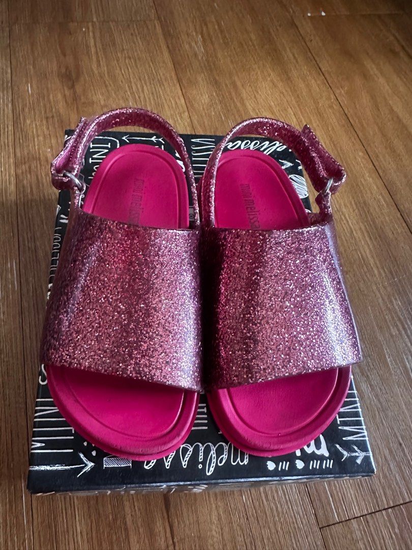 Mini Melissa Beach Slide Sandals Pink Glitter Size 8 (Category: Flats & Sandals) located in Manila. Submitted by talula000 (Listing ID 1407162086, Image 1). Description: - Mini Melissa beach slide sandals - Pink glitter design - Size: USA 8 - Adjustable strap for secure fit - Model number: 31997 - Made in Brazil - Ideal for beach or casual wear.