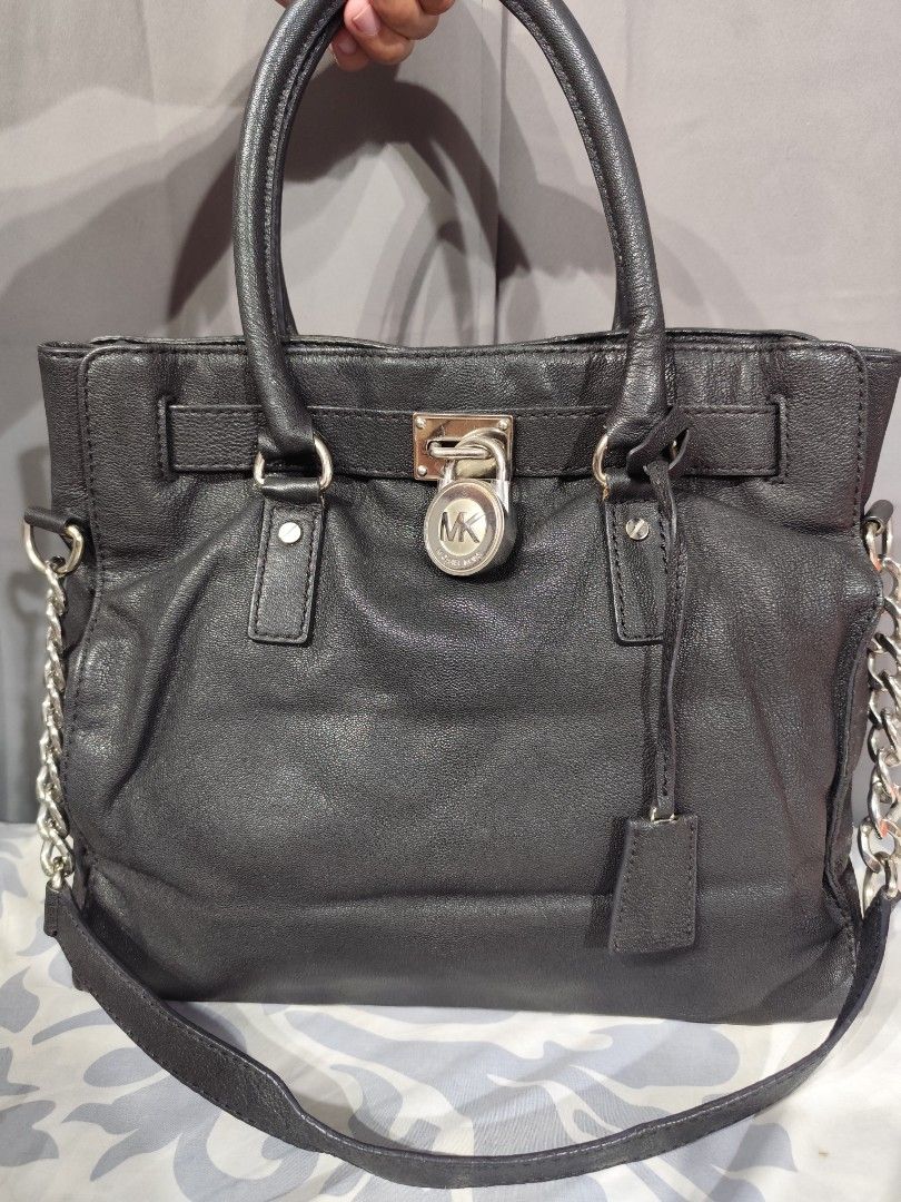 MK Hamilton large complete w/ lock & key (Category: Luxury Bags & Wallets) located in Santa Rosa. Submitted by ahroncatpad (Listing ID 1407147229, Image 1). Description: Mk Hamilton black 35cm height x 36cm length complete with lock and key very good used condition silver hardwares in good condition leather in good condition inside cloth need wash.