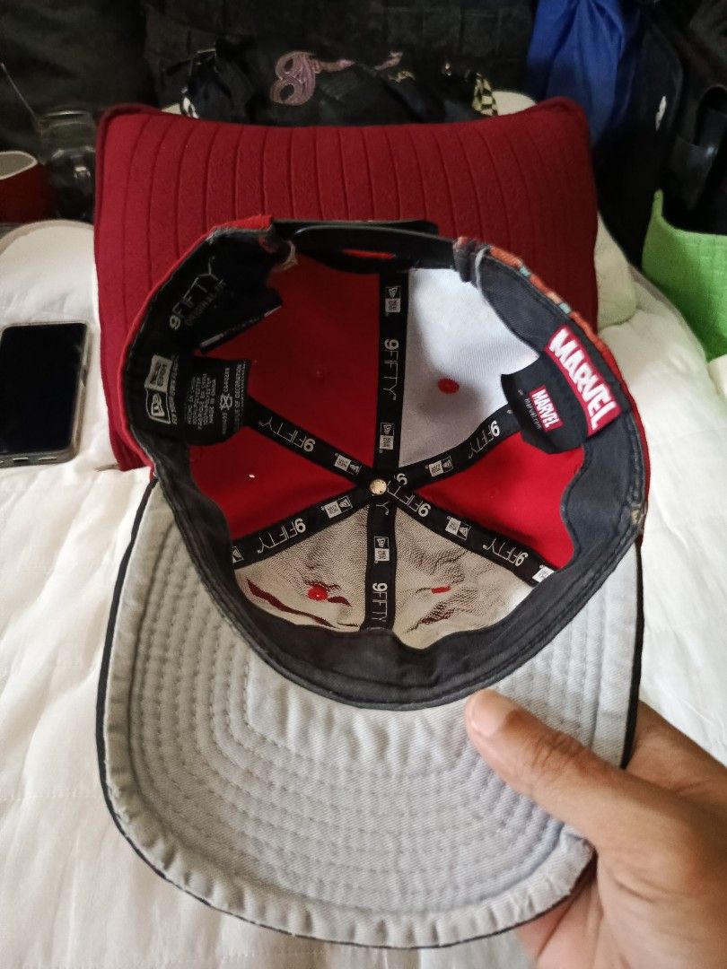 New Era Deadpool Cap (Category: Caps & Hats) located in Irosin. Submitted by whanchore55263 (Listing ID 1407034483, Image 3). Description: - New Era 9Fifty cap - Features a Deadpool logo - Red and black design - Flat brim - Snapback closure - Marvel tag inside - Design on the back.