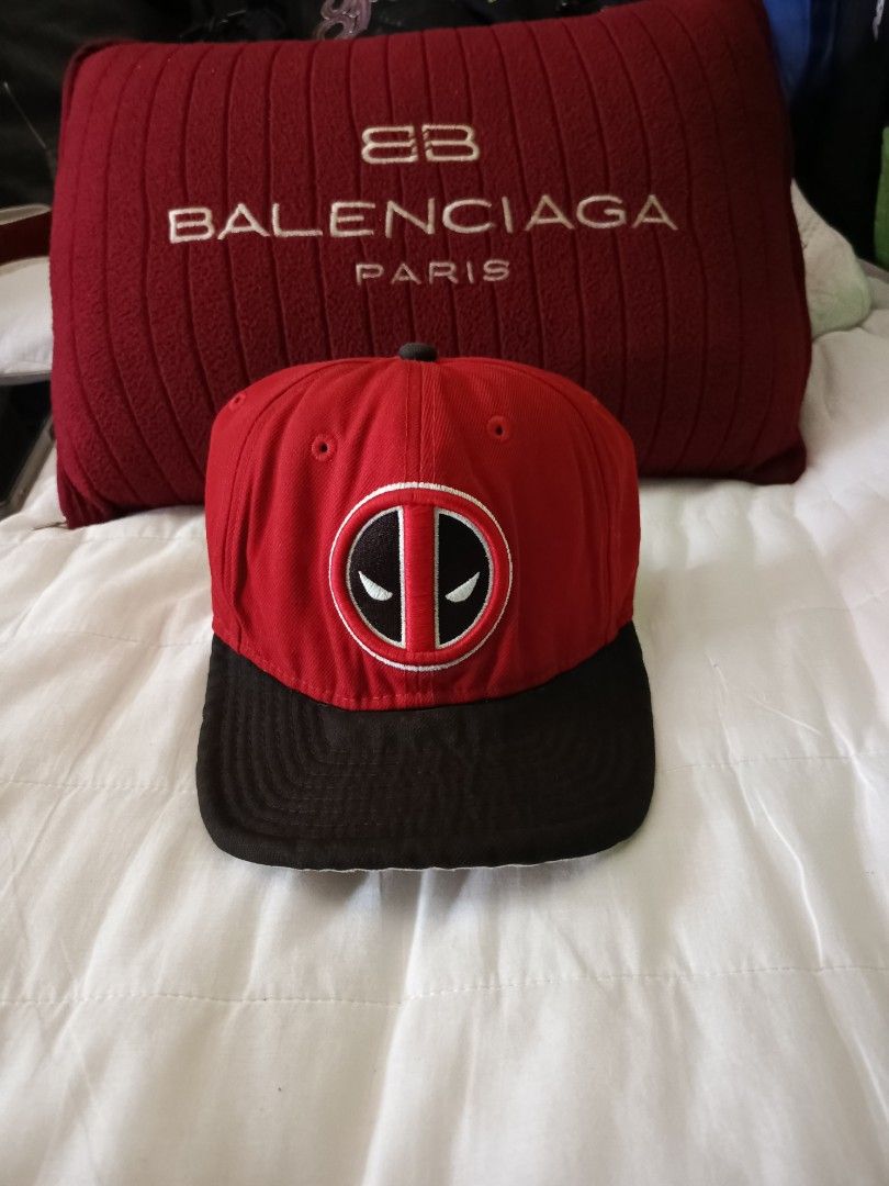 New Era Deadpool Cap (Category: Caps & Hats) located in Irosin. Submitted by whanchore55263 (Listing ID 1407034483, Image 1). Description: - New Era 9Fifty cap - Features a Deadpool logo - Red and black design - Flat brim - Snapback closure - Marvel tag inside - Design on the back.