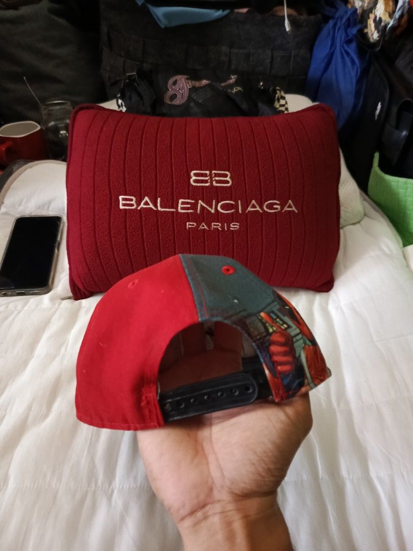 New Era Deadpool Cap (Category: Caps & Hats) located in Irosin. Submitted by whanchore55263 (Listing ID 1407034483, Image 2). Description: - New Era 9Fifty cap - Features a Deadpool logo - Red and black design - Flat brim - Snapback closure - Marvel tag inside - Design on the back.