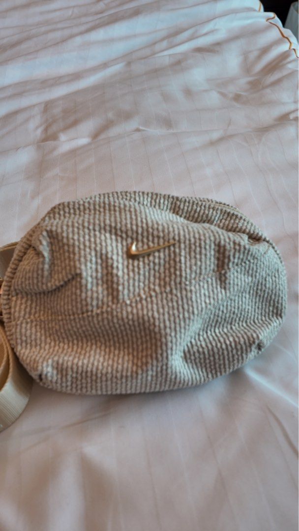 Nike Aura - Cross Body Bag (Category: Cross-body Bags) located in Quezon City. Submitted by kalachuchi (Listing ID 1407118289, Image 1). Description: Aura - Cross Body Bag Color: Light Khaki/Light transparent gold Orig price: 1,895.