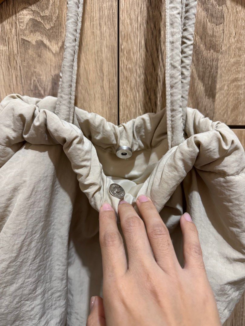 SURPLUS Nylon Hobo Bag | Beige Color (Category: Shoulder Bags) located in San Carlos. Submitted by goodfindsph2015 (Listing ID 1407130154, Image 2). Description: - This is a casual, light beige or off-white nylon hobo bag with a ruched top and a shoulder strap - good as new Shipping via J&T.