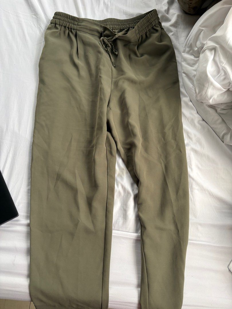 Olive Green Drawstring Pants ZARA (Category: Other Bottoms) located in Quezon City. Submitted by authentic_c (Listing ID 1407016485, Image 1). Description: - Olive green pants - Drawstring waist - Relaxed fit - Lightweight material - Straight leg - Solid color - Ideal for casual occasions.
