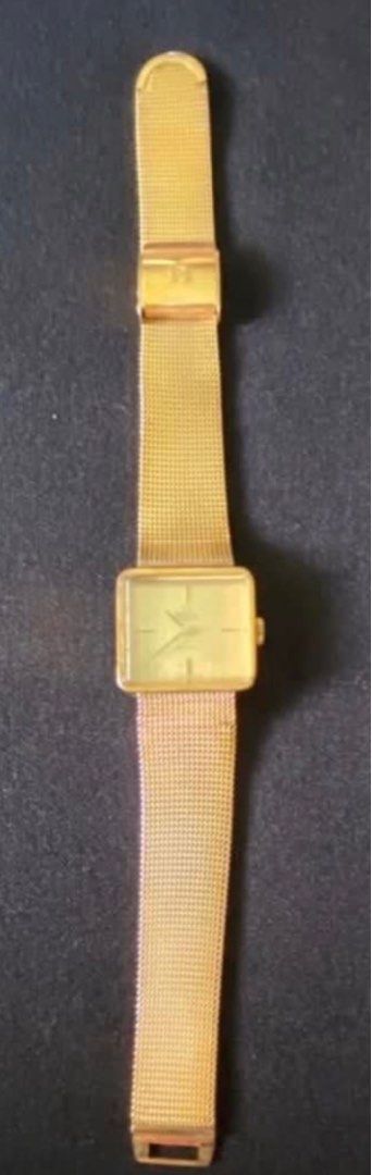 Omega De Ville Automatic Gold Watch (Category: Luxury Watches) located in Paranaque City. Submitted by bloo_berry (Listing ID 1407191152, Image 2). Description: Vintage Omega De Ville automatic watch with a gold-toned square dial and mesh strap. Features a gold-colored case and a classic design. The watch has a visible Omega logo and De Ville inscription on the dial. The watch has a crown on the side for time adjustment. Bracelet adjustable up to