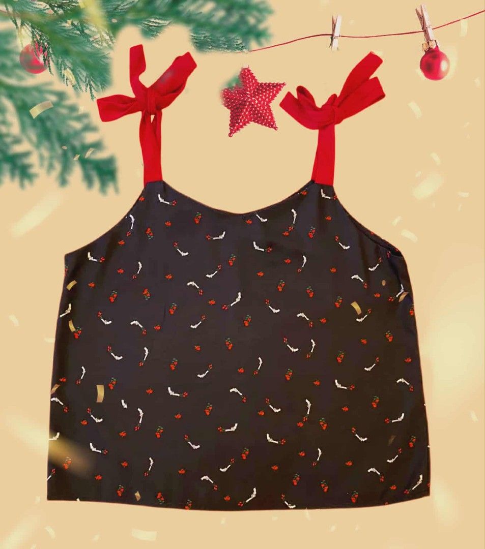 Plains and Prints/ R.A.F. (Category: Blouses) located in Manila. Submitted by prettypink4 (Listing ID 1407072282, Image 2). Description: - Unique print with red and white accents - Dark background - Red tie straps - V-neck design - Size 02 - Comfortable and stylish.
