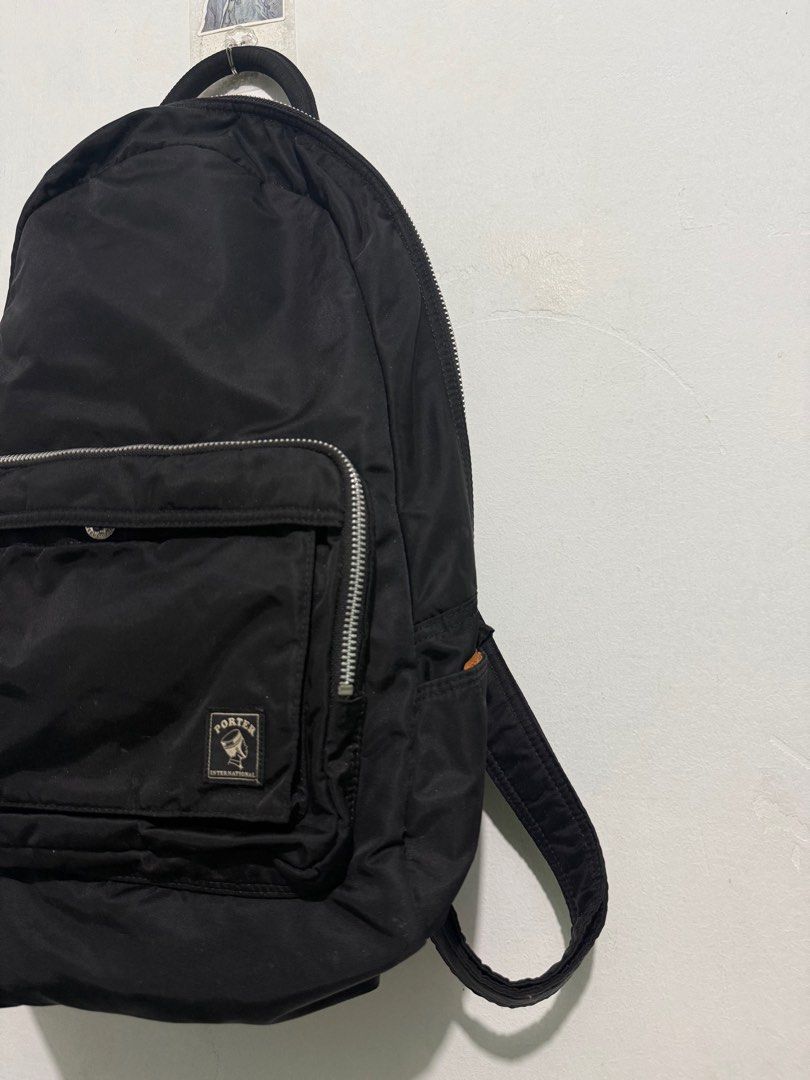 Porter Black Backpack (Category: Backpacks) located in Sorsogon. Submitted by jovert_23alviz (Listing ID 1407157162, Image 3). Description: - Black Porter backpack - Front pocket - Top handle - Adjustable shoulder straps - Main compartment with orange lining - Zipper closure - Interior Porter tag - Front logo - Made of nylon.