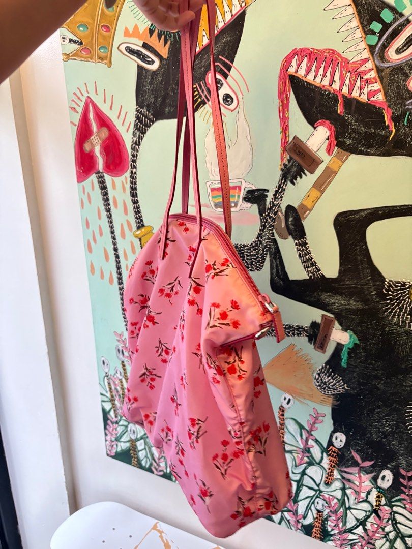 Prada Floral Print Tote Bag (Category: Luxury Bags & Wallets) located in Quezon City. Submitted by theoddyeti (Listing ID 1407060153, Image 2). Description: - Authentic Prada tote bag - Eye-catching floral print - Stylish pink leather straps - Secure zip closure - Includes authenticity cards and strap - Features the iconic Prada logo Store bought comes complete paperbag, tags, strap , dustbag. Selling v low.