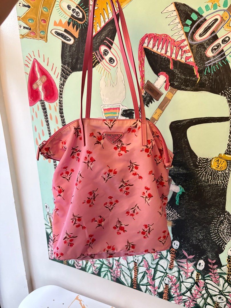 Prada Floral Print Tote Bag (Category: Luxury Bags & Wallets) located in Quezon City. Submitted by theoddyeti (Listing ID 1407060153, Image 1). Description: - Authentic Prada tote bag - Eye-catching floral print - Stylish pink leather straps - Secure zip closure - Includes authenticity cards and strap - Features the iconic Prada logo Store bought comes complete paperbag, tags, strap , dustbag. Selling v low.