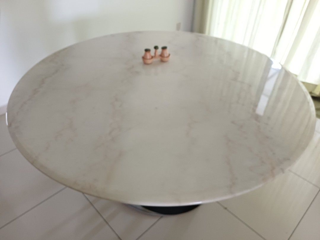Solid Round Marble Dining Table (Category: Tables & Sets) located in Puchong. Submitted by derricklau95 (Listing ID 1407151477, Image 2). Description: This round, white marble table features a sleek polished surface with beautiful natural veining, bringing a clean and modern look to any space. Designed with a strong steel base for excellent stability, it comfortably accommodates more than 6 seaters. Perfect for dining rooms, meeting areas, or spa